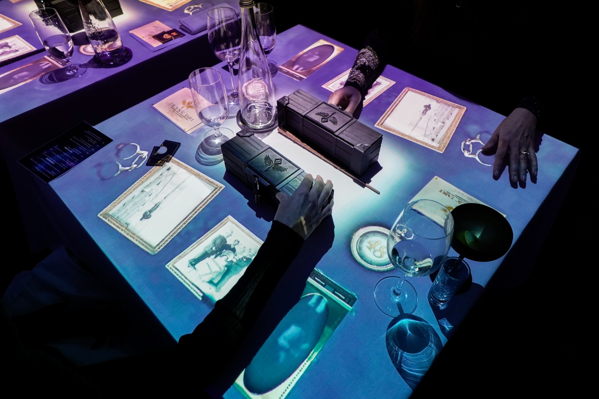 a table with cards and glasses