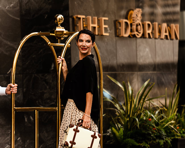 a woman standing in front of a building