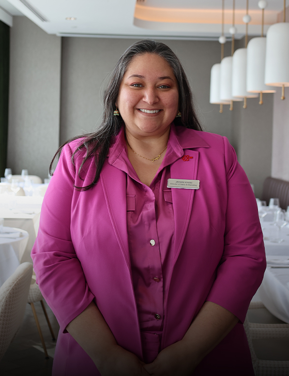 a woman in a pink suit