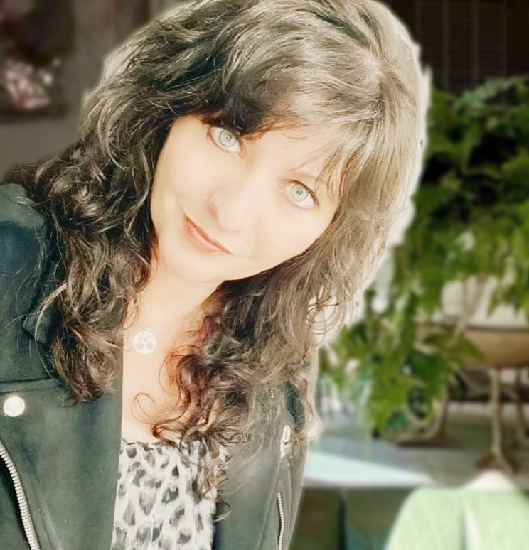 a woman with long curly hair