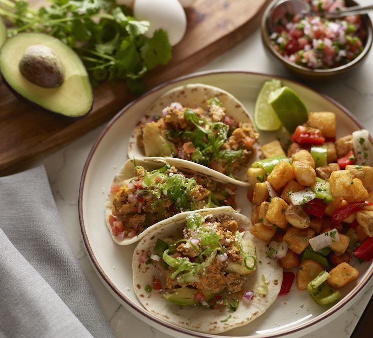 a plate of tacos and vegetables