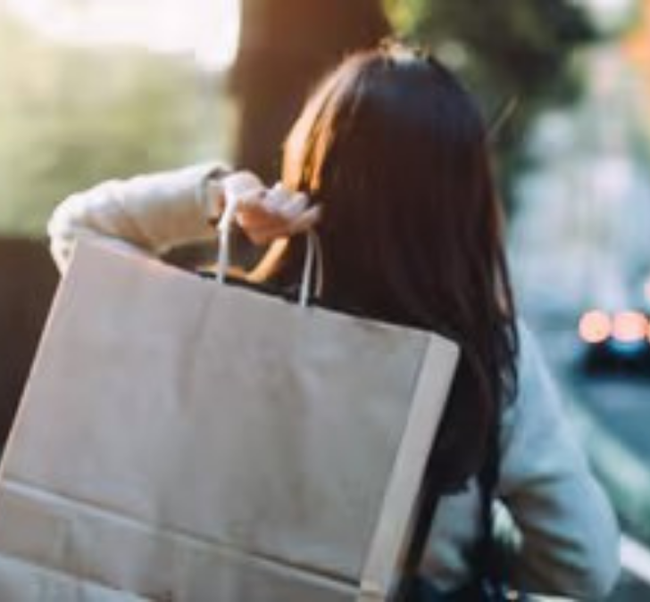 a woman carrying a bag