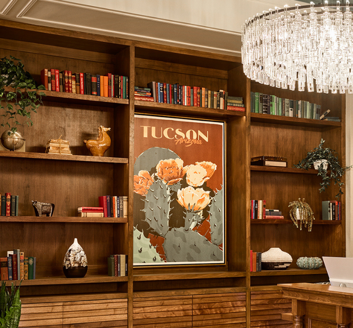 a room with bookshelves and a poster