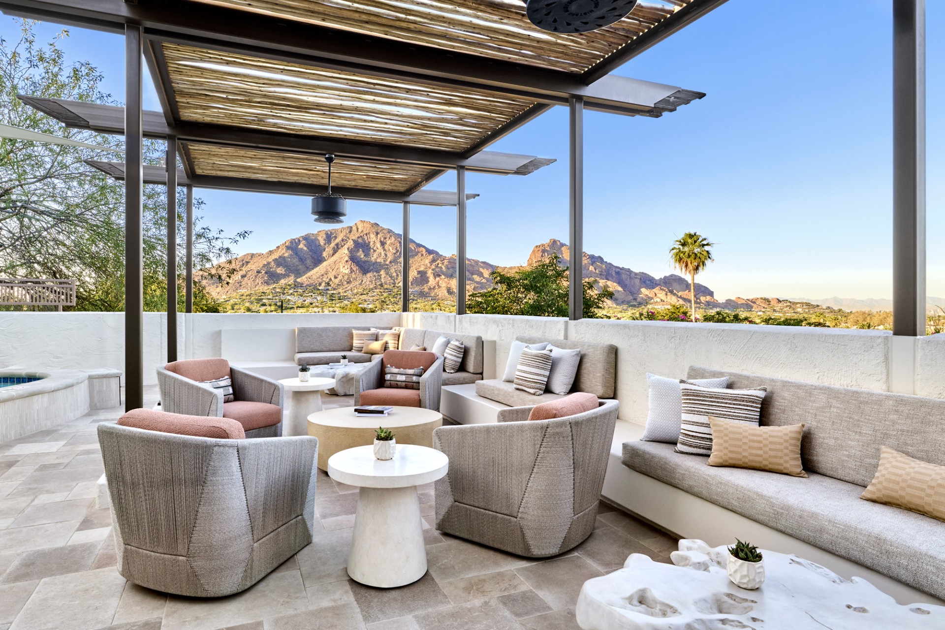 a patio with couches and tables