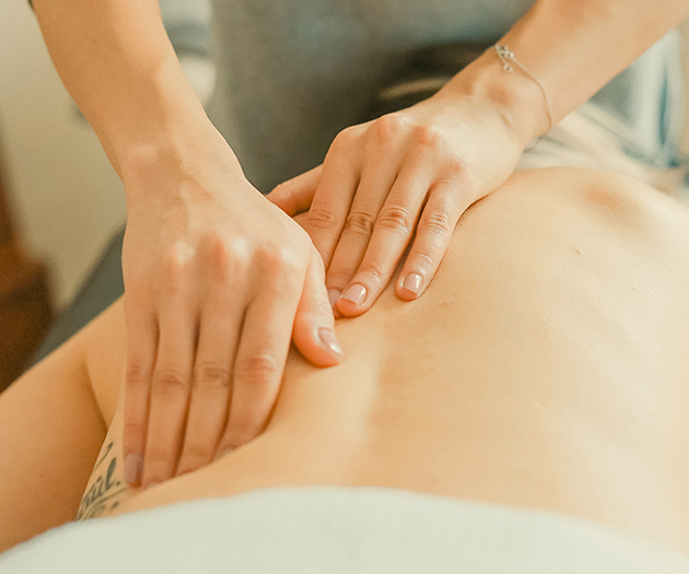 a person receiving a back massage
