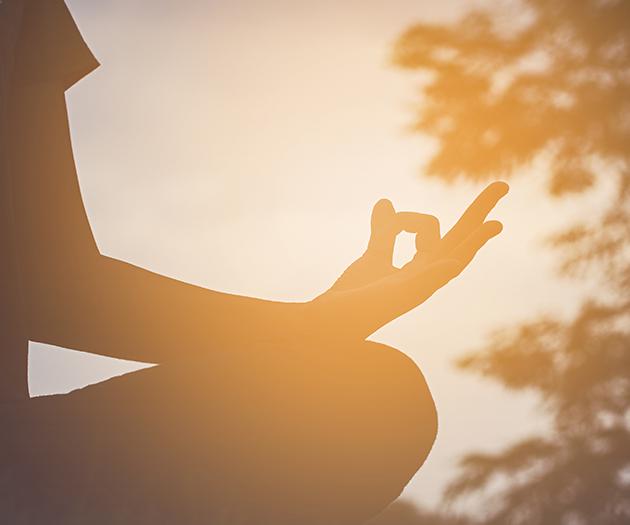 a person doing yoga outside