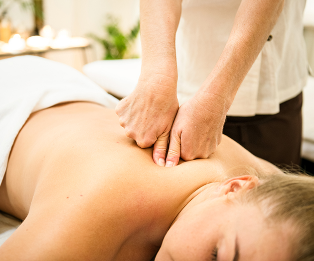 a person receiving a back massage