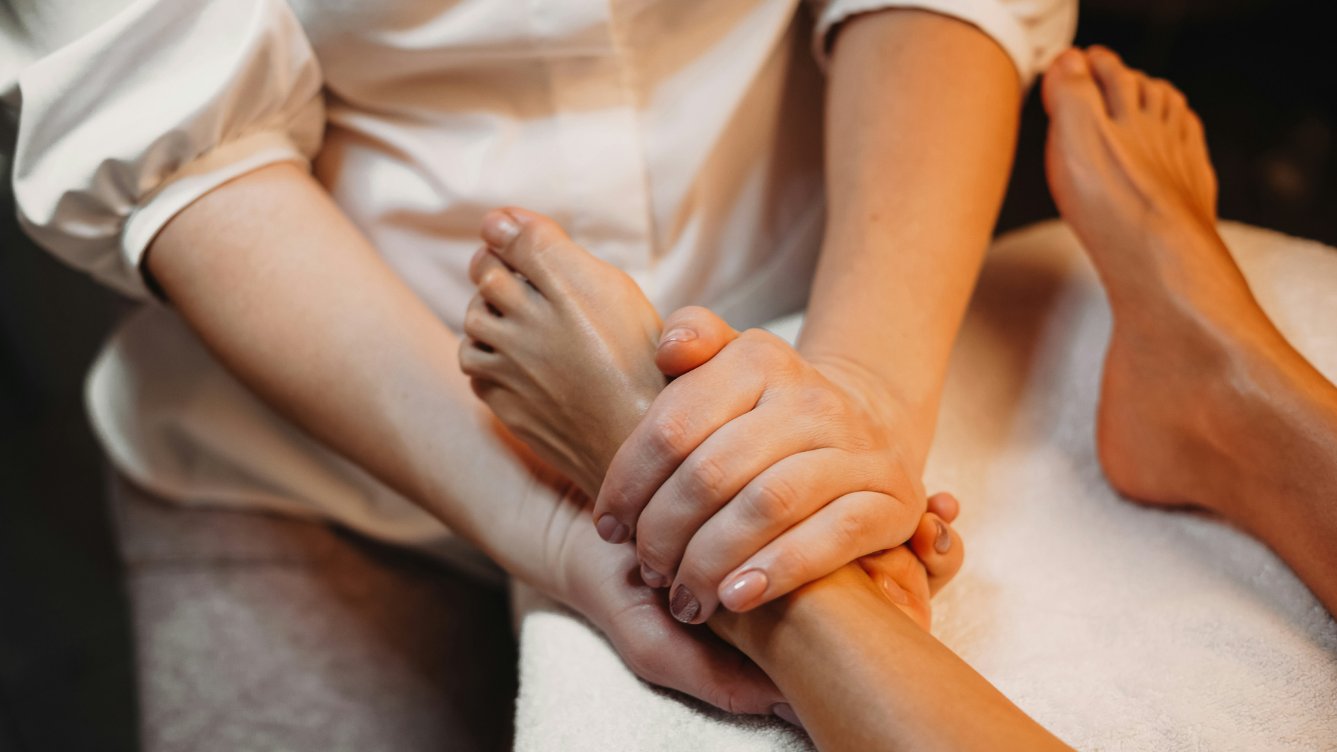 a person holding a person's foot