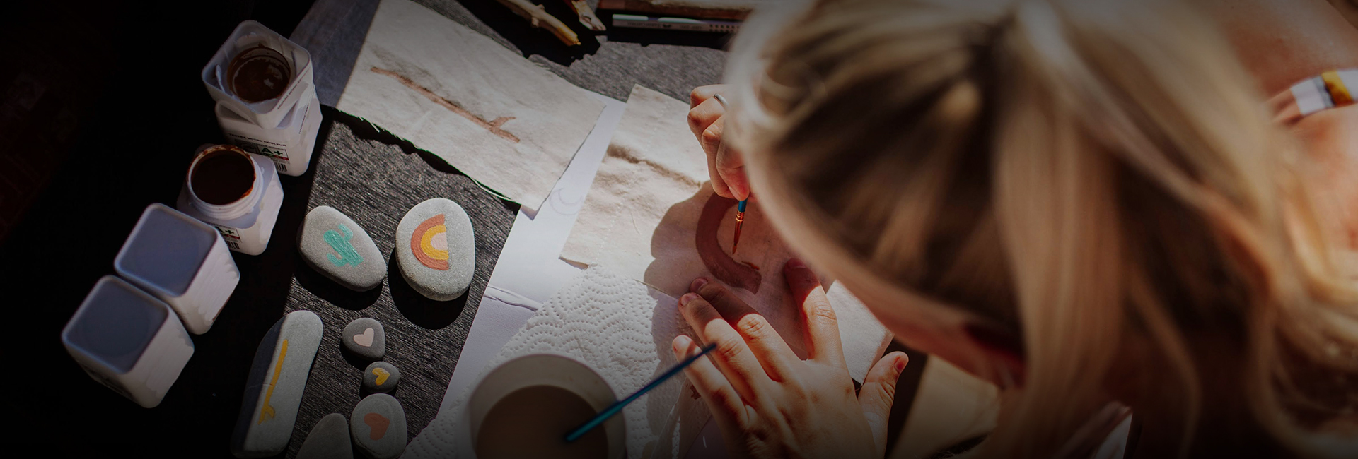 a person painting on a cloth
