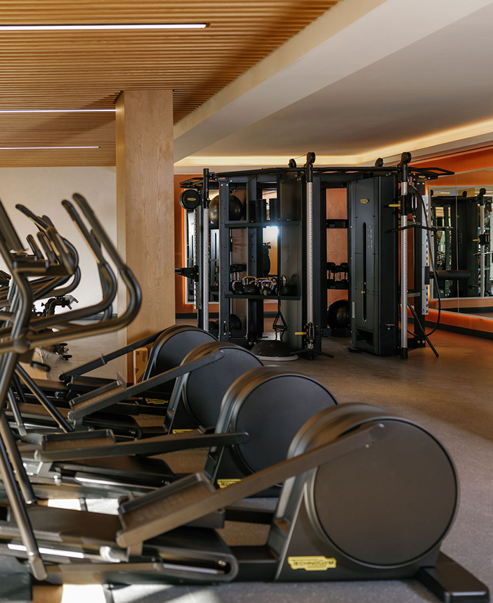a group of exercise equipment in a gym