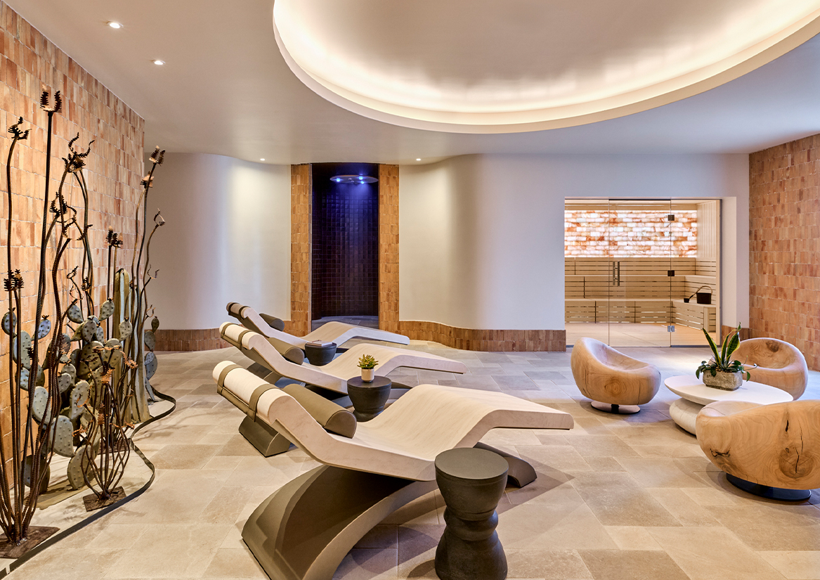 a room with chairs and a pool