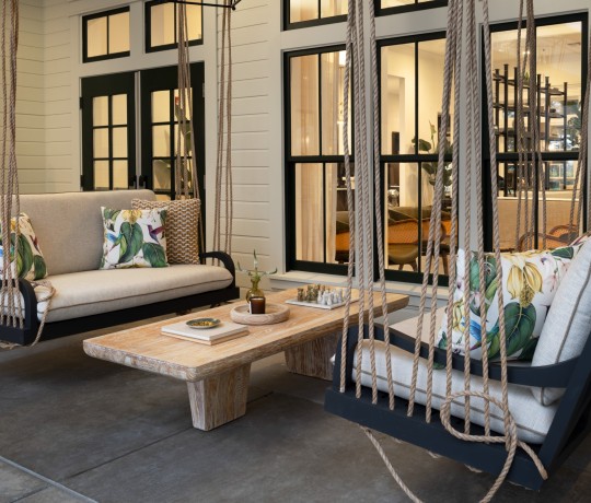 a patio with a table and chairs