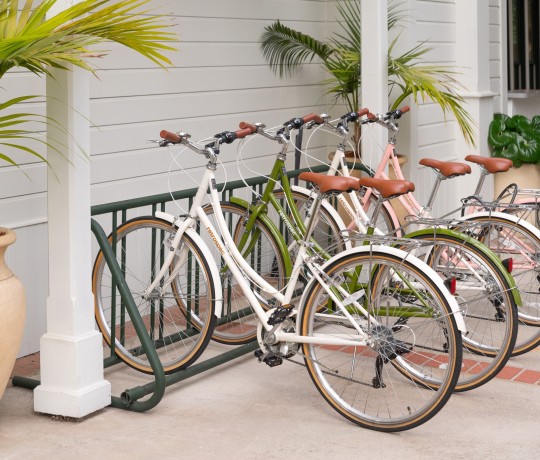 a group of bicycles parked next to a building