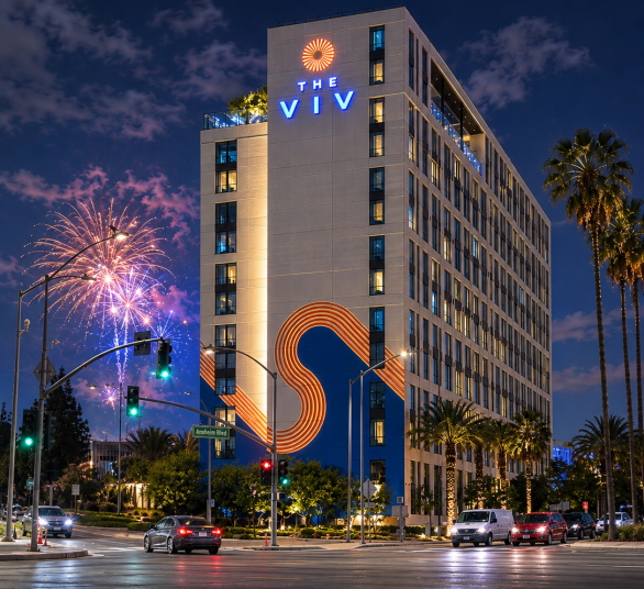 a building with palm trees and fireworks