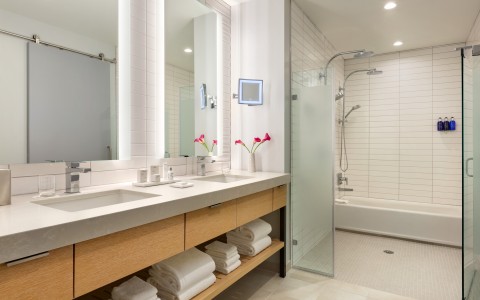 a bathroom with a shower and sink