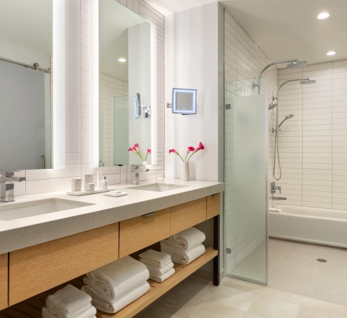 a bathroom with a shower and sink