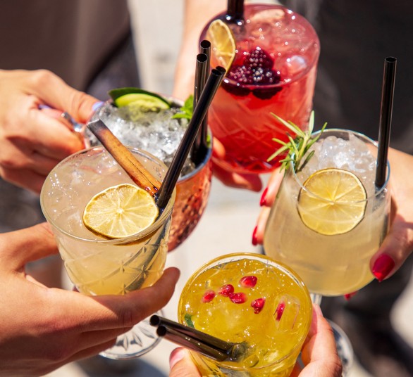 a group of people holding drinks