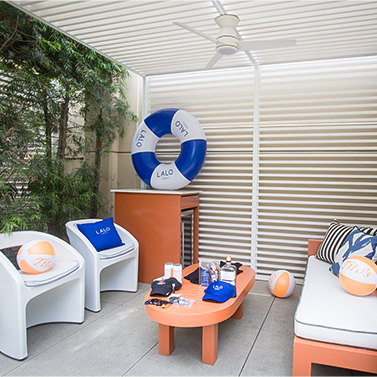 a patio with a couch and chairs