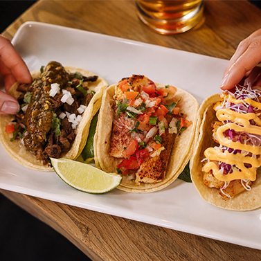 a plate of tacos on a table
