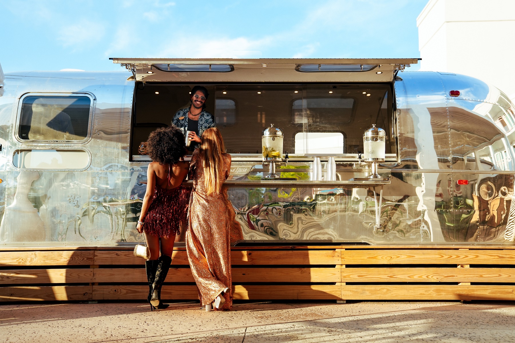 women standing in front of a food truck