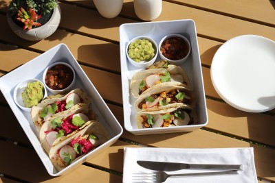 a group of food in containers on a table