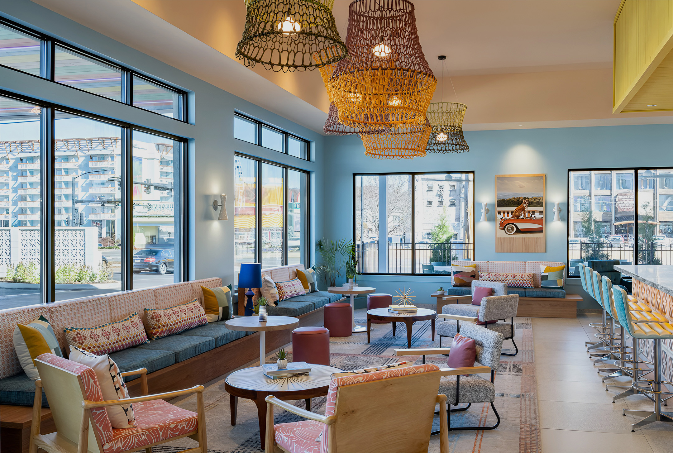 a room with a couch and chairs