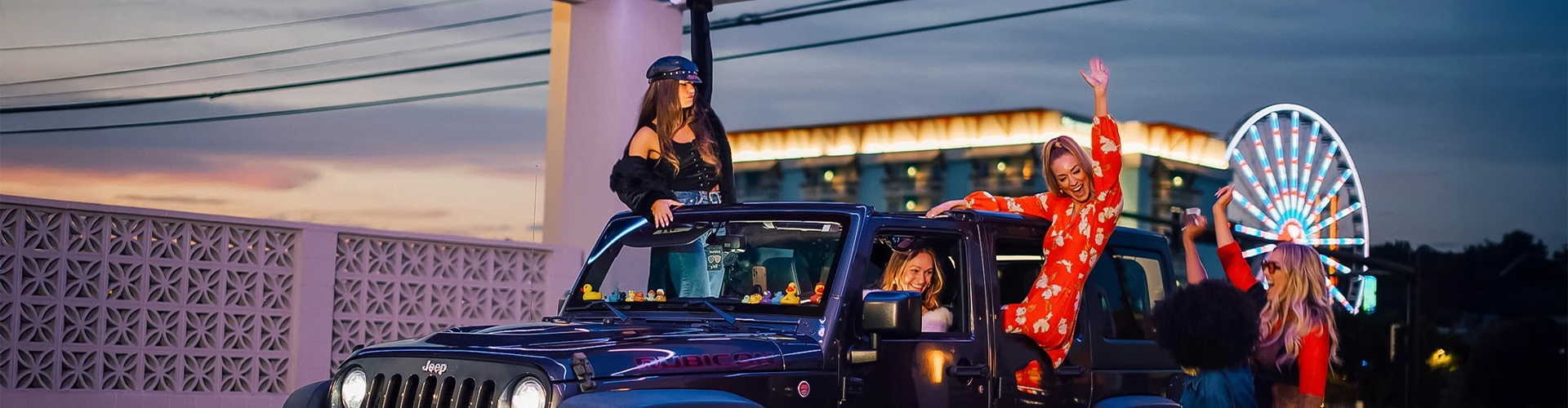 a group of women standing in a car