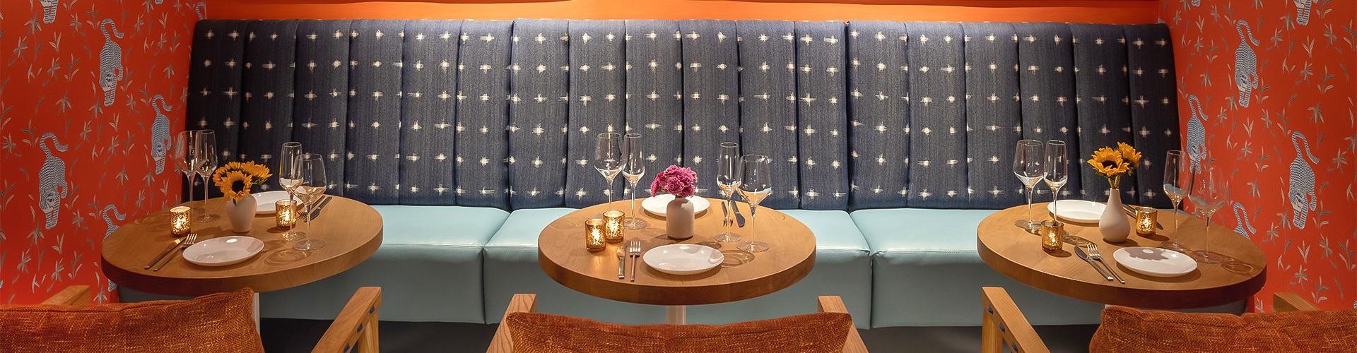 a table with wine glasses and candles