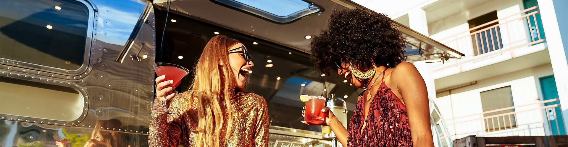two women laughing at each other
