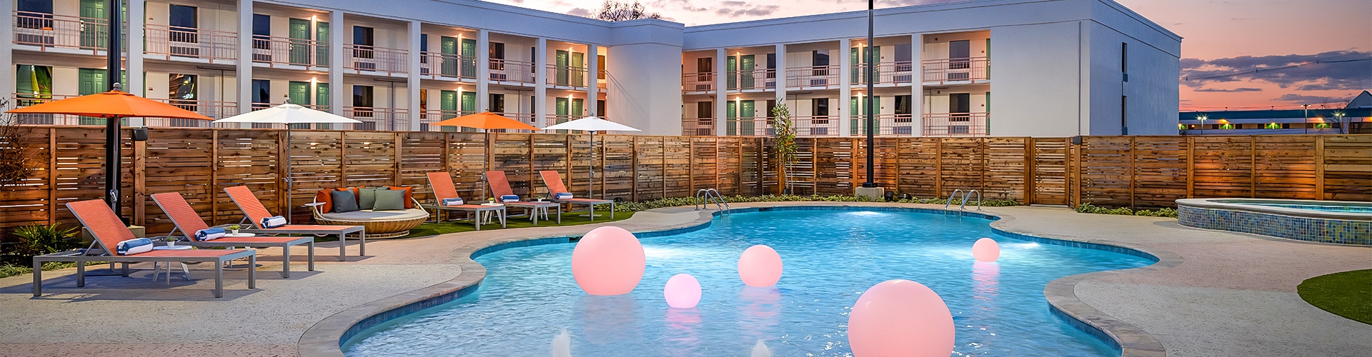 a pool with pink balls in it